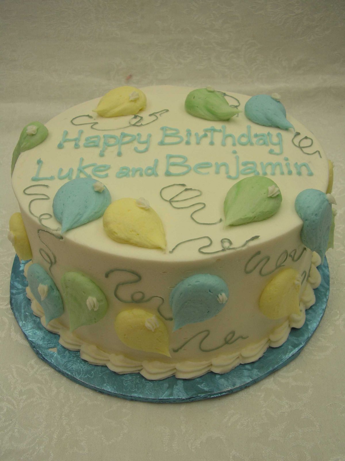 Individual balloons on birthday cake