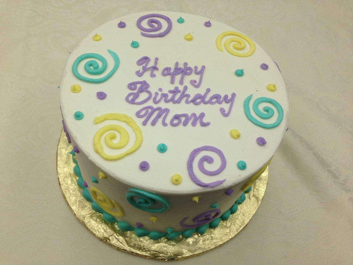 birthday cake with dots and swirls