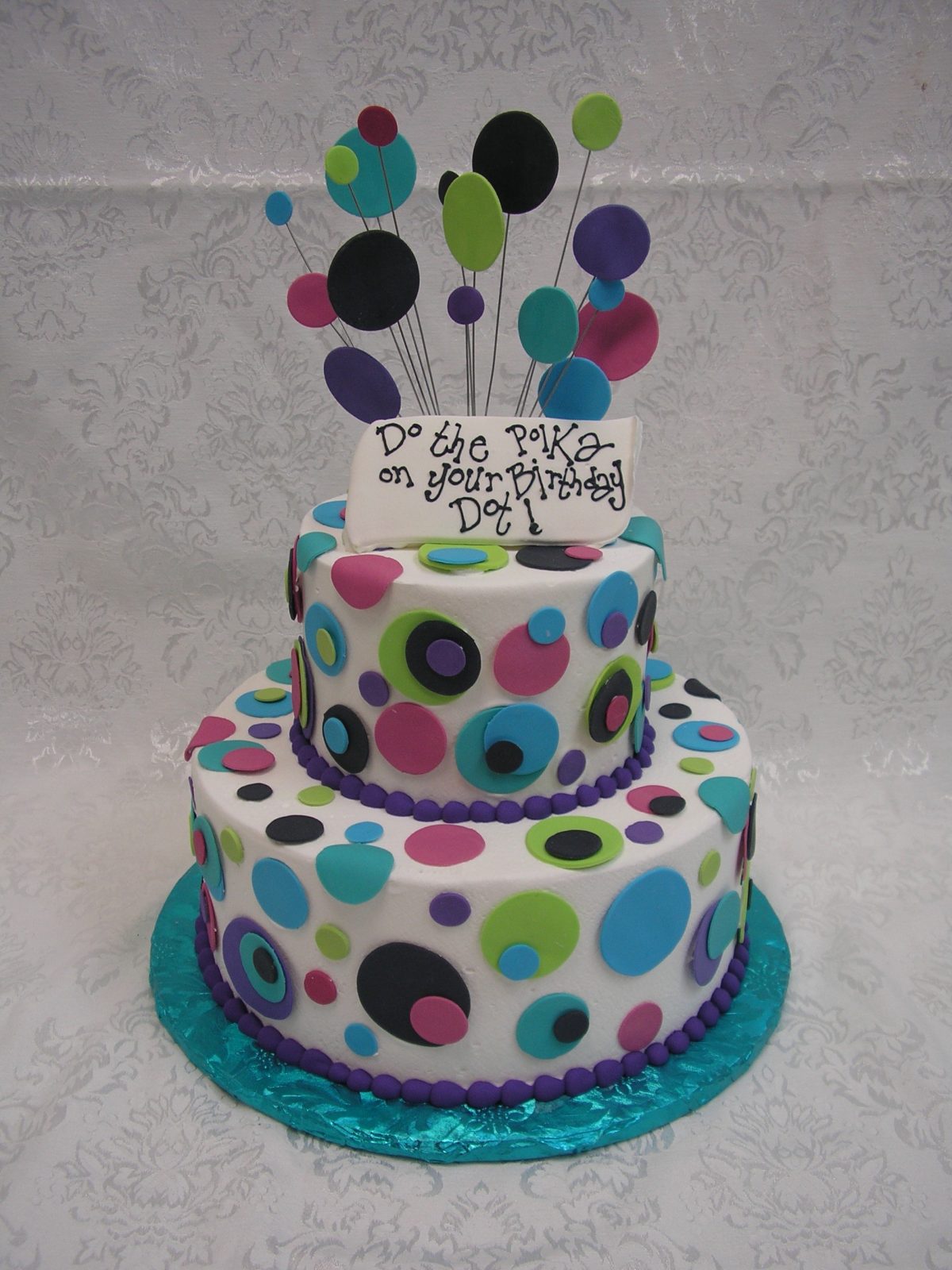 two tier cake with polka dots
