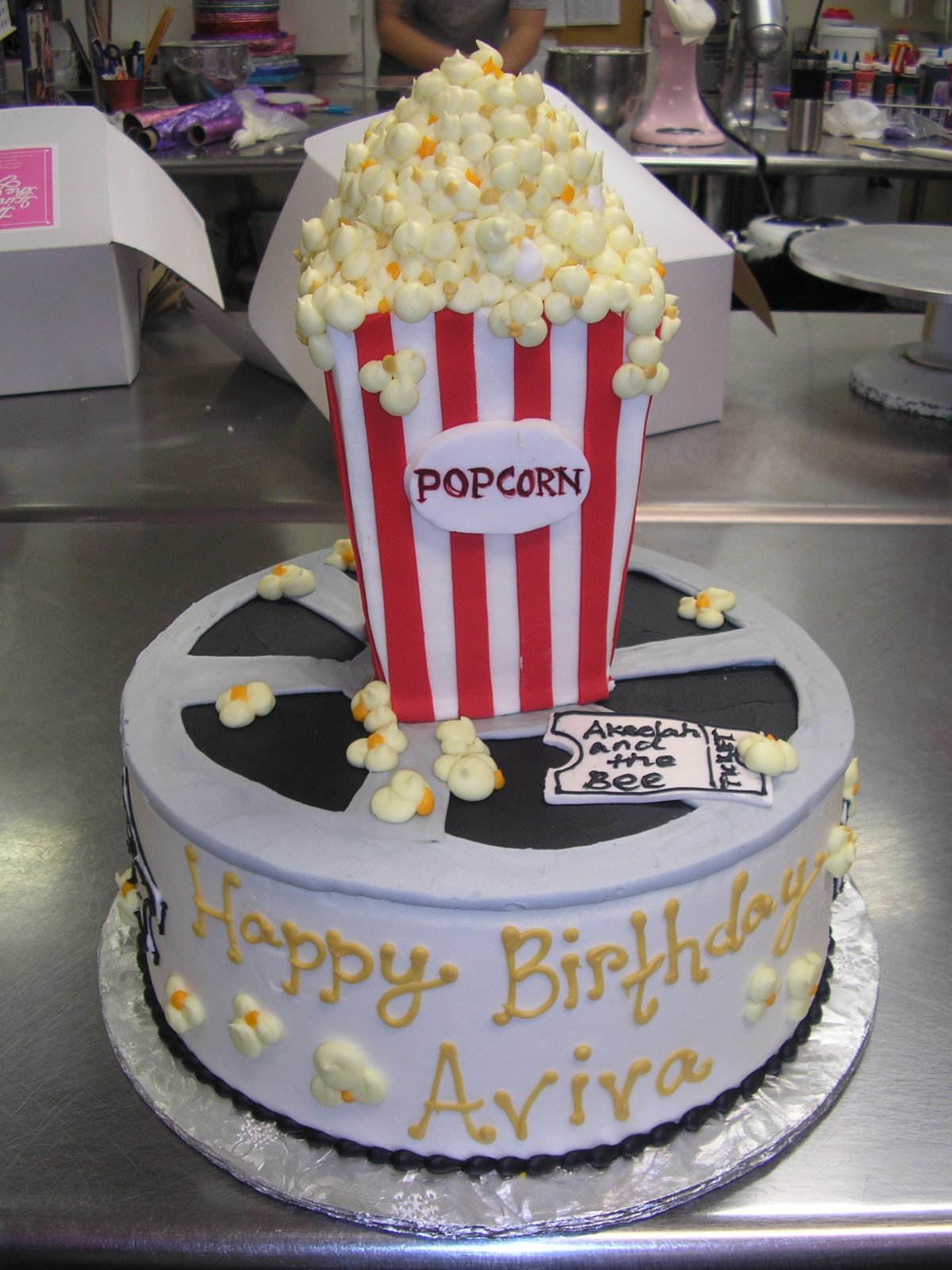 3D popcorn and movie reel on a cake